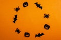 Halloween background, paper black bats, pumpkins and spiders on an orange background, frame Royalty Free Stock Photo