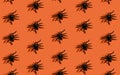 Halloween background pattern. Scary black spider on orange paper. Minimal design for halloween party concept