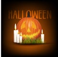 Halloween background with pumpkin with candles and grass