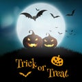 Halloween background with pumpkins against a moonlit sky