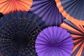 Halloween background from round paper fans in purple, orange and black multi-layered composition.