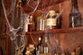 Halloween background Shelves with alchemy tools Skull spiderweb bottle with poison candles