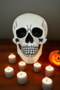 Halloween background. Skull's, pumpkin and candles Royalty Free Stock Photo