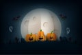 Halloween background in spooky night paper art style.Halloween pumpkins,flying bats and full moon in graveyard Royalty Free Stock Photo