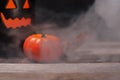 Halloween pumpkin with smoke and light in the dark night Royalty Free Stock Photo