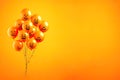 Halloween balloons on orange background