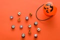 Halloween basket-pumpkin. Candy with traditional decorations for Halloween.