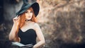 Halloween Beautiful young Witch girl in witches hat