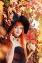 Halloween Beautiful young Witch girl in witches hat