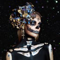 Halloween beauty portrait of a skeleton woman of death Bokeh glitter, the makeup on the face. Girl death Halloween costume. Day of Royalty Free Stock Photo