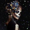 Halloween beauty portrait of a skeleton woman of death Bokeh glitter, the makeup on the face. Girl death Halloween costume. Day of Royalty Free Stock Photo