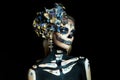 Halloween beauty portrait of a skeleton woman of death, the makeup on the face. Girl death Halloween costume. Day of The Dead. Royalty Free Stock Photo