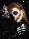 Halloween beauty skeleton woman makeup face Bokeh glitter. Girl death Halloween costume. Day of The Dead. Charming and dangerous Royalty Free Stock Photo