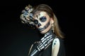 Halloween beauty skeleton woman makeup face. Girl death Halloween costume. Day of The Dead. Charming and dangerous Calavera Royalty Free Stock Photo