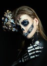 Halloween beauty skeleton woman makeup face. Girl death Halloween costume. Day of The Dead. Charming and dangerous Calavera Royalty Free Stock Photo