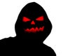 Halloween black hooded silhouette with a evil scary pumpkin face isolated on a white background Royalty Free Stock Photo