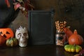 Halloween blank invitation with pumpkins, skull, spooky spiders, pumpkin head jack-o-lantern. Space for text.