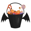 A halloween bucket with bat wings filled with sweets. Cartoon illustration of a basket for Halloween. Vector drawing for