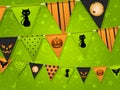 Halloween bunting on green background