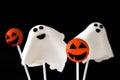 Halloween cake pops with phantom and pumpkin shape isolated on black background Royalty Free Stock Photo
