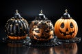 Halloween cakes decorated with chocolate in the shape of a pumpkin isolated on a dark background