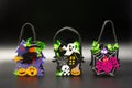 Halloween Candy Bags Cute Felt Pouches with Handles, Trick or Treat Goody Bags on black background