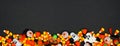 Halloween candy long border banner on a black background Royalty Free Stock Photo