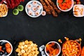 Halloween candy buffet double border over a black stone background Royalty Free Stock Photo