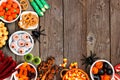 Halloween candy buffet table corner border over a rustic wood background with copy space Royalty Free Stock Photo