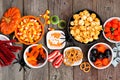 Halloween candy buffet table top view over a rustic wood background Royalty Free Stock Photo