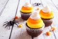 Halloween candy corn cupcakes over white wood Royalty Free Stock Photo