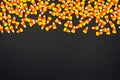 Halloween candy corn top border on a black background