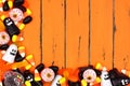 Halloween candy corner border over old orange wood Royalty Free Stock Photo