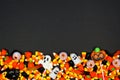 Halloween candy bottom border on a black background with copy space Royalty Free Stock Photo