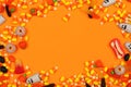 Halloween candy frame against an orange background with copy space Royalty Free Stock Photo