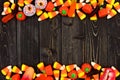 Halloween candy double border over dark wood Royalty Free Stock Photo