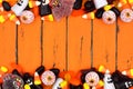 Halloween candy double border over old orange wood