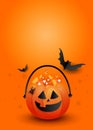 Creative vertical poster mockup. Halloween candy pumpkin bag with scary black bats on an orange background with copyspace Royalty Free Stock Photo