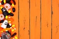 Halloween candy side border over old orange wood Royalty Free Stock Photo