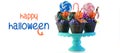 Halloween candyland drip cake style cupcakes with lollipops and candy on white. Royalty Free Stock Photo