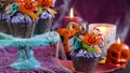 Halloween candyland drip cake style cupcakes in party table setting. Royalty Free Stock Photo