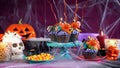 Halloween candyland drip cake style cupcakes in party table setting. Royalty Free Stock Photo