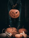 Halloween card with girl holding a Hallooween pumpkin