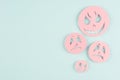 Halloween cartoon mock up for advertising, design, cover - pink paper emoji faces fly on pastel candy mint blue background.