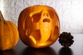 Halloween carved ghost pumpkin lantern. Creative pumpkin decorating ideas, scary ghostly silhouette carving cut out.