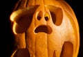 Halloween carved ghost pumpkin lantern. Creative pumpkin decorating ideas, scary ghostly silhouette carving cut out.