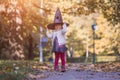 HALLOWEEN CELEBRATION CARD. Cute toddler girl in black witch hat Royalty Free Stock Photo