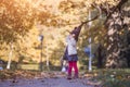 HALLOWEEN CELEBRATION CARD. Cute toddler girl in black witch hat sunny autumn pak Royalty Free Stock Photo