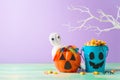 Halloween celebration concept with candy corn and candy in jack o lantern bucket for trick and treat Royalty Free Stock Photo