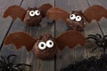Halloween chocolate donut hole bats against dark wood